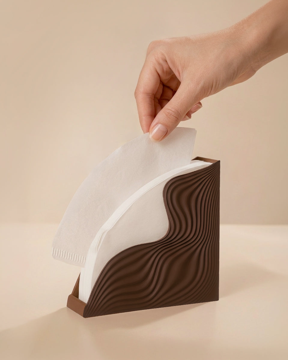 Hand taking a V60 filter from holder